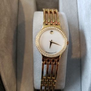 Movado ladies gold watch with diamond bezel